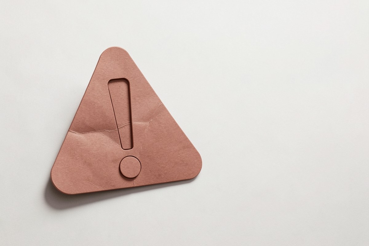 A warning information sign with an exclamation mark, placed on a solid background.
